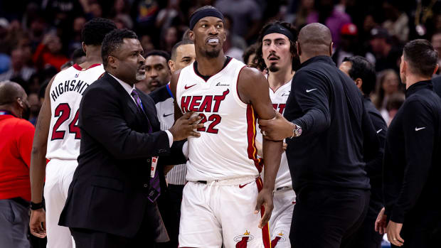 Miami Heat forward Jimmy Butler (22) and New Orleans Pelicans forward Naji Marshall (8) and guard Jose Alvarado (15) are ejected after a melee due to a play during the second half at Smoothie King Center.